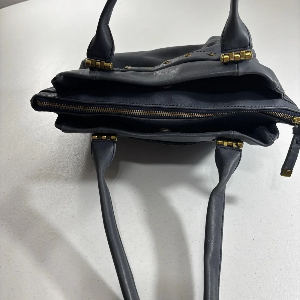 The Sak Serena Leather Handbag Navy Blue Tobacco Souk Floral Embossed